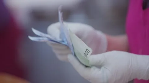 Slow motion of Korean vendor counting banknotes at Gwangjang Market Stock Footage 314851003