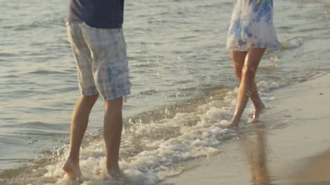 Slow motion of lady playing with her boyfriend in the sea Stock Footage 74276228