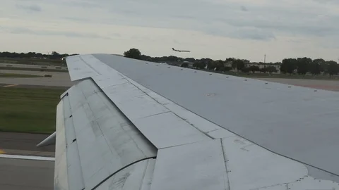 Slow Motion Landing Alongside 2nd Airplane at MSP Stock Footage 91474850
