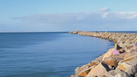 Slow motion landscape of the calm ocean surface along the shipwreck walkway and Stock Footage 345858500