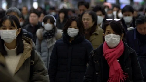 Slow motion large crowd people wearing surgical mask walking in subway exit-Dan Stock Footage 124397890