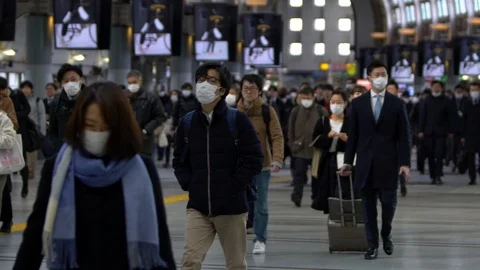 Slow motion large crowd people wearing surgical mask walking in subway exit-Dan Stock Footage 124397942