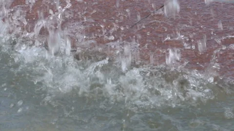 Slow motion of large drops of cool water that fall into the city fountain on a 스톡 동영상 149440166