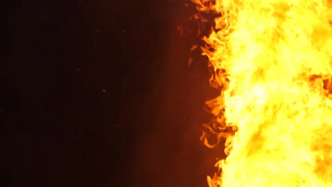 Slow Motion - Large Fire Burns, Sparks And Embers Fly Stock Footage 195281739