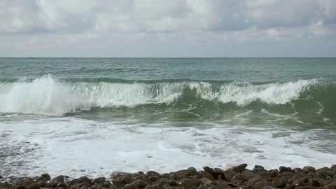 Slow motion large foam wave on the shore Stock Footage 82929717
