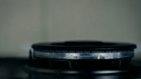 SLOW MOTION: on a large gas burner, a gas is turned on and off on the home. Stock Footage 82242135