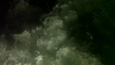 Slow motion of large wake behind a boat at night Stock Footage 82632057