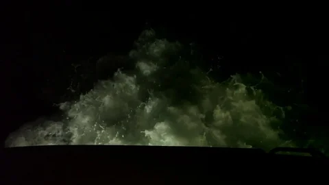 Slow motion of large wake behind boat at night Stock Footage 82632105