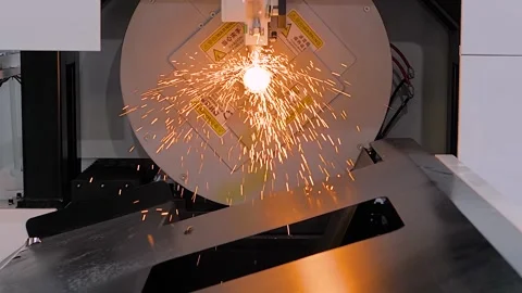 Slow motion: laser cutting machine is operating on metal workpiece with sparks Stock Footage 341324028