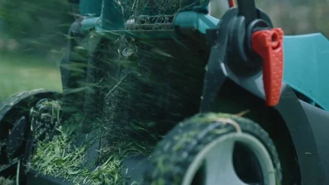 Slow motion lawn mower cutting grass Stock-Footage 71996723