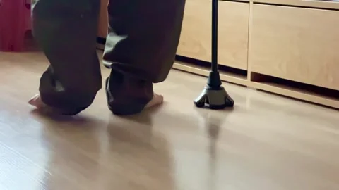 Slow motion, the legs of an old man walking slowly with a cane Stock Footage 304675830