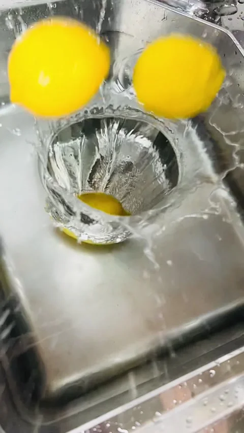 Slow Motion Lemon Falling into Water, Citrus Splash in Kitchen Sink Stock Footage 337785207
