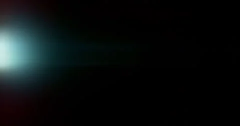 Slow motion of lens flare isolated on black background. Anamorphic lens. Stock Footage 335508255