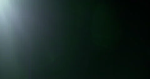 Slow motion of lens flare isolated on black background. Anamorphic lens. Stock Footage 335508264