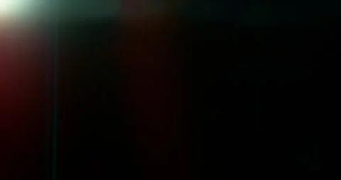 Slow motion of lens flare isolated on black background. Anamorphic lens. Stock Footage 335508294