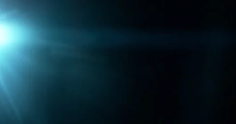 Slow motion of lens flare isolated on black background. Anamorphic lens. Stock Footage 335508353