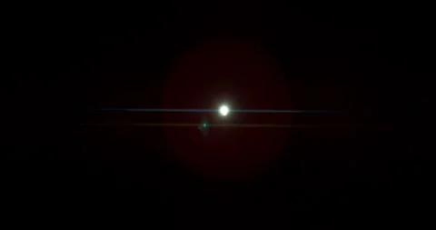 Slow motion of lens flare isolated on black background. Anamorphic lens. Stock Footage 335508474