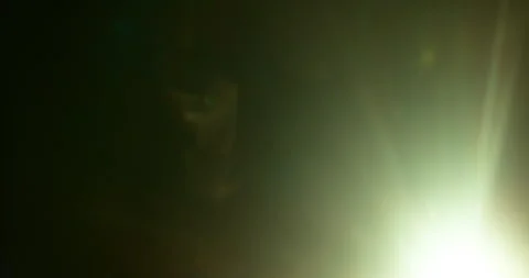 Slow motion of lens flare isolated on black background. Anamorphic lens. Stock Footage 335508545