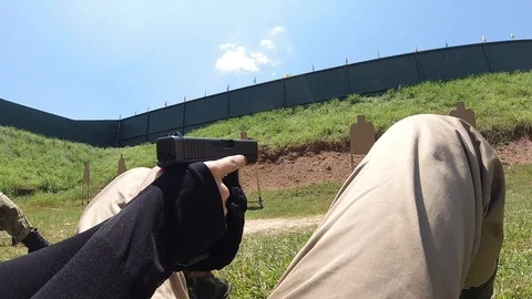 Slow motion Lie shooting position、 Ground Position shooting Glock 19/17 Video stock 119691846