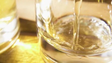 Slow motion light beer pour into a glass close-up Stock Footage 90812636