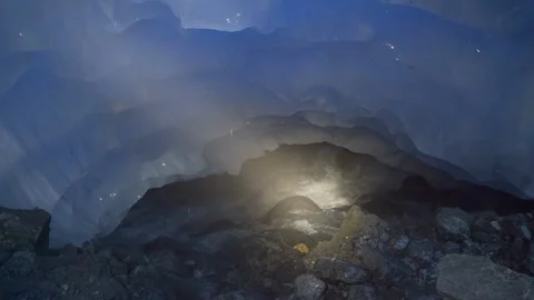 Slow Motion of Light Moving on Swift Stream in Amazing Ice Cave, Mendenhall 스톡 동영상 113945804