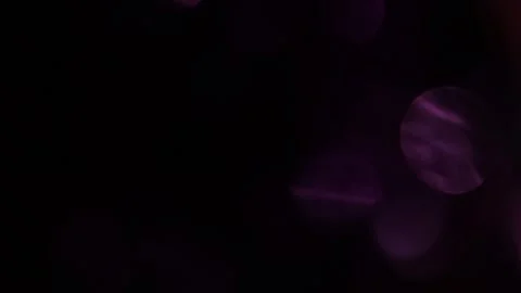 Slow motion of light on sparkling purple bokeh Видео 318944441