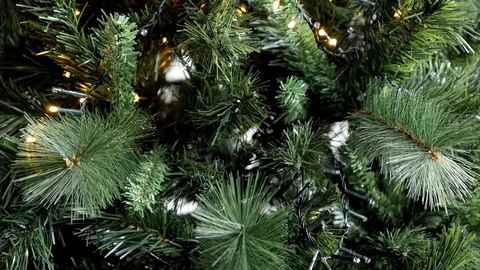 Slow motion lights blinking on artificial Christmas tree branches FullHD Stock Footage 121620073