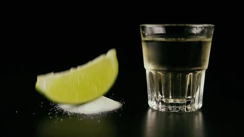 Slow motion. Lime slice falls on salt Video stock 76433561