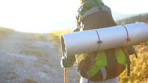 Slow motion little backpacker walking through rural landscape Stock-Footage 118936927