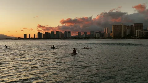 Slow Motion Lockdown Shot Of People Floating With Surfboards On Sea By Buildings Stock Footage 229949669