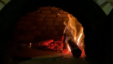 Slow motion of logs burning in pizza wooden oven Stock Footage 152417460