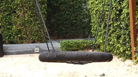 Slow motion. lonely swing in motion. Stock Footage 104848514