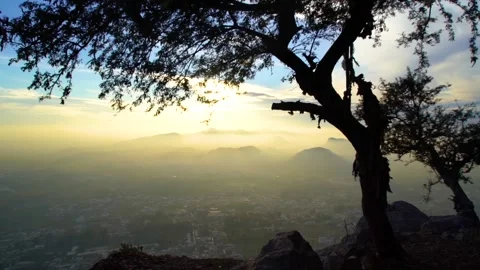 Slow motion long shot musty hills at sunset with tree in forgroung  in Pakis Stock Footage 199271604