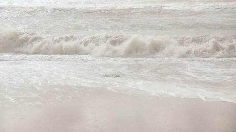 Slow motion the long wave of the sea rolls on the shore Stock Footage 82025922