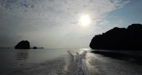 Slow motion, look back from boat returning from geopark tour, sunset Stock Footage 317551110