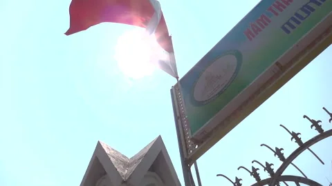 Slow motion look up flag sun flare reveal Stock Footage 271062209