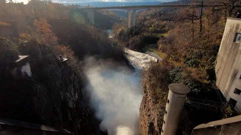 Slow motion looking down tilt down dirty brown flooded river water Stock Footage 120921837
