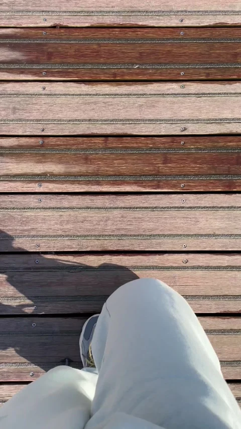 Slow motion, looking down, walking on a wooden boardwalk, travel, on the road Vídeos de archivo 255226993