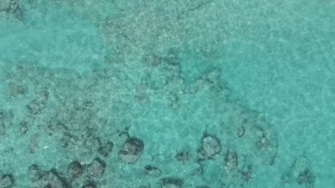 Slow motion looking straight down at the ocean and beach in Bermuda Stock-Footage 313844108