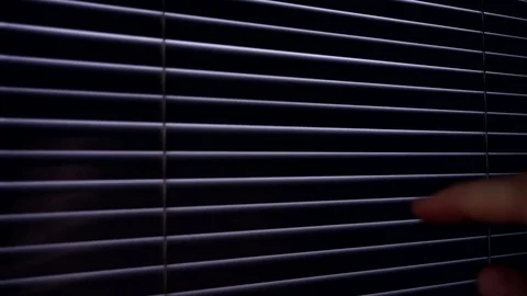 Slow motion looking through the blinds 스톡 동영상 70030159