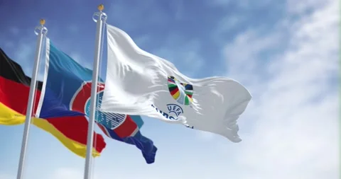 Slow motion loop of Euro 2024, UEFA and Germany flags fluttering in the wind Stock Footage 236994404