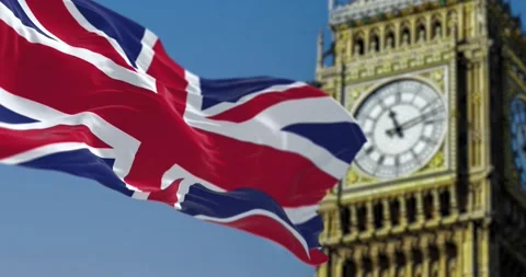 Slow motion loop of UK flag waving with blurred Big Ben on the background Stock Footage 236994265