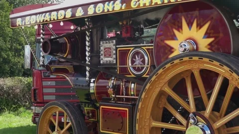 Slow motion looping clip of a traction engine showing bright paintwork in motion Stock Footage 247497265