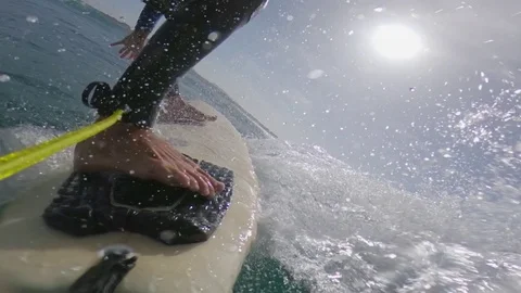 SLOW MOTION, LOW ANGLE: Experienced male surfer carving waves on a beautiful day Stock Footage 83631898
