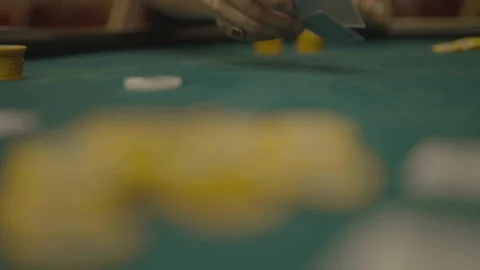 Slow motion low angle player flipping cards, camera facing player Stock Footage 334037352
