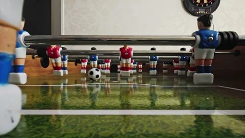Slow motion: Low angle point of view shot inside a foosball table Stock Footage 335168012