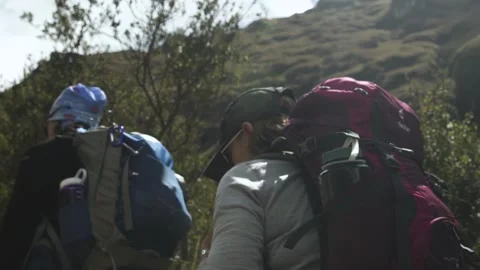 Slow motion low angle three hickers on Inca trail. Cusco, Peru Stock Footage 130431513