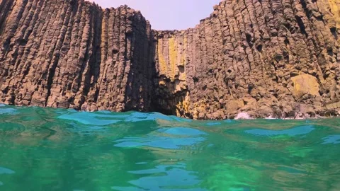 Slow motion low angle view of geological formation of basalt cave and wall with  Stock Footage 238500472