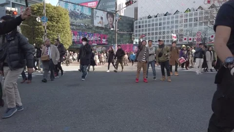 Slow motion low angle view to the street while many people walking crossing.. 動画素材 309919225