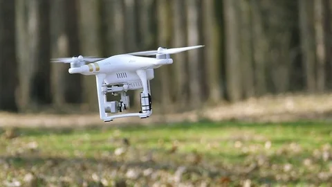 Slow motion. Low flying drone  turns camera direction Video stock 73851333